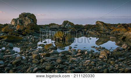 Rock pool at dawn near the beach at Cape Agulhas, South Africa