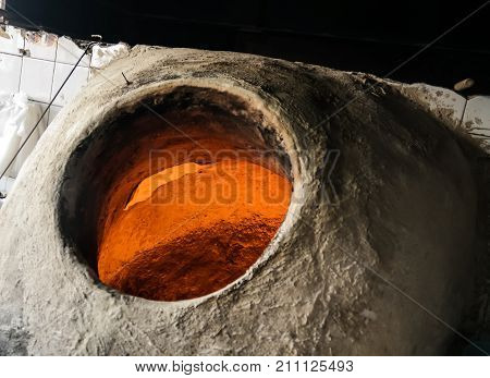 Baking the bread in tandoor at Manama, Bahrain