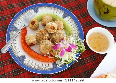 Deep Fried Crab Meat Rolls or Hoi Jo. Traditional local Chinese food for appetizer. (selective focus)
