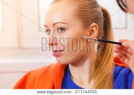 Closeup Woman Getting Make Up On Cheek