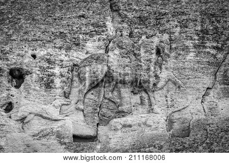 Madara Rider - an archaeological monument of the early Middle Ages (the end of the 7th century) a relief image of a rider carved on a steep rock. Bulgaria. Black and white.