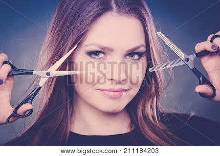 Elegance and classy. Fashion style of hairdo. Female professionalist with scissors. Elegant woman presents her hairdresser's saloon.