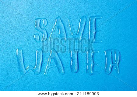 Save the water and save life on the planet. Letters from spilled water drops