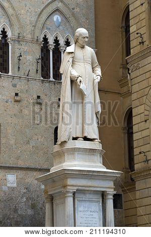 SIENA, ITALY - SEPTEMBER 24, 2017: Monument to the famous priest the learned economist of the 18th century Salustio Bandini on Piazza Tolomei