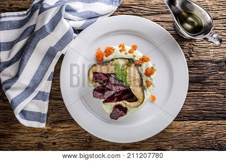 Sturgeon Fillet With Caviar Beetroot And Dill On Plate In Hotel Or Restaurant