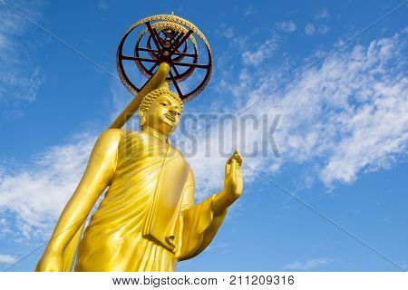 Golden Buddha statue at Wat KeereeWong NakhonSawan Thailand.