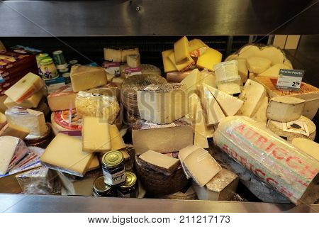 ALKMAAR NETHERLANDS - APRIL 21 2017: Display of traditional Dutch cheese like Edam and Gouda cheese at local cheese shop Alkmaar the Netherlands
