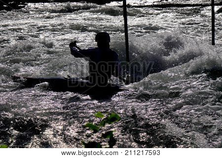 a man with canoe Kayak at the sunset