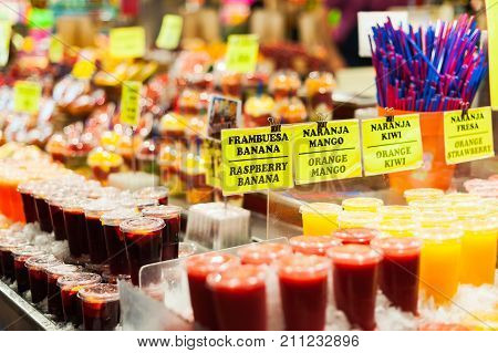 Barcelona, Catalonia, Spain - May 14, 2012 : Fruit juices on a stall in the Boqueria covered market.