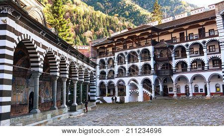 Rila, Bulgaria - October 27, 2017: Rila monastery view with autumn mountain trees at background