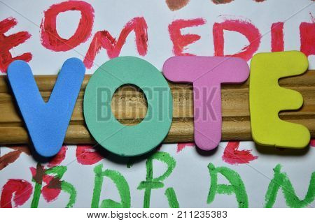 word vote on a  abstract colored background