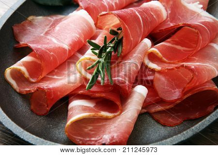 prosciutto with rosemary or ham of black forest or serrano.
