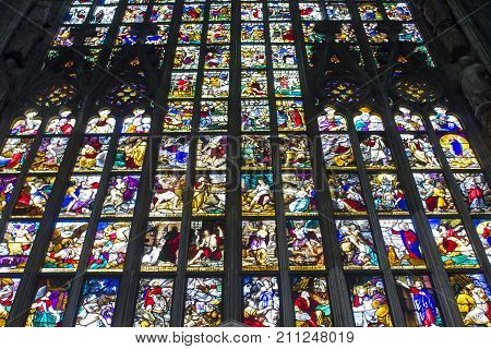 MILAN, ITALY - MAY 11 2015: Giant colorful window of Milano Duomo Cathedral with apostolic depictions