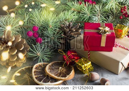 Red Christmas  Gift  Box With Red Ribbon And Fir Branches