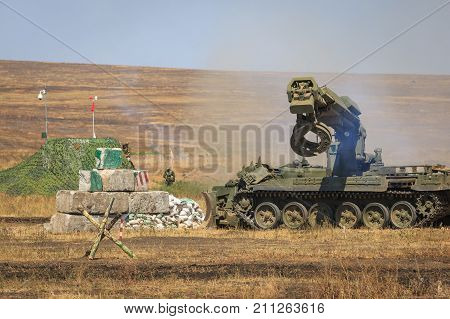 NOVOCHERKASSK RUSSIA 26 AUGUST 2017: The modern Russian armored combat engineer machine IMR-2 in the process of work at the military training ground at summer day