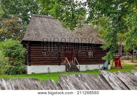 Old wooden building. Wooden hut in nature green scenery.