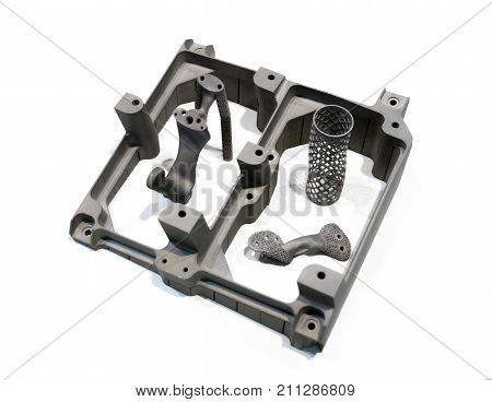 Object printed on metal 3d printer isolated on white background close-up. A model created in a laser sintering machine close-up. DMLS, SLM, SLS technology. Progressive modern additive technology.