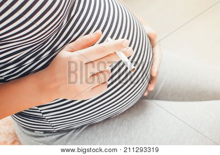 Pregnant Girl With Cigarettes