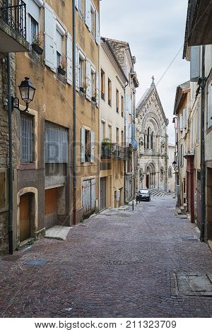 Street leading to Saint Laurent Church in Aubenas in the Ardeche region in France
