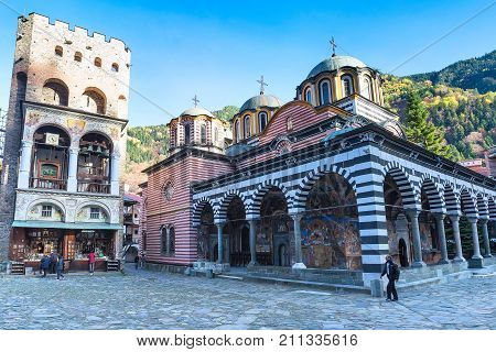 Rila, Bulgaria - October 27, 2017: Rila monastery view with autumn mountain trees at background