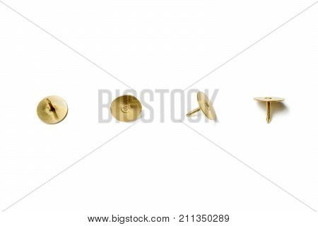 Small Collection Of 4 Brass Thumbtacks Arranged In A Line On White Background