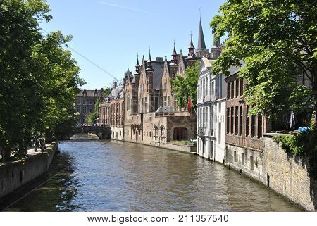Canalsights in Bruges with the historical skyline