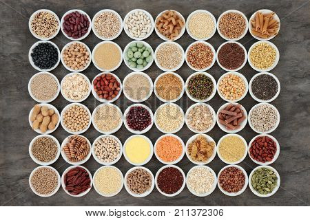 Macrobiotic health food with a selection of legumes, seeds, nuts, grains, vegetables, cereals and whole wheat pasta with super foods high in protein, omega 3, anthocyanins, antioxidants and vitamins.