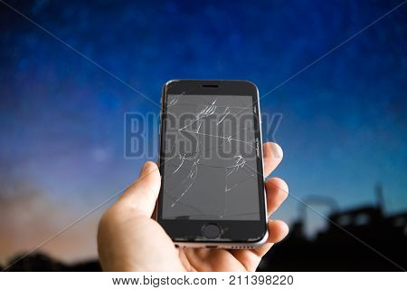 the screen broken telephone blue background. mobile