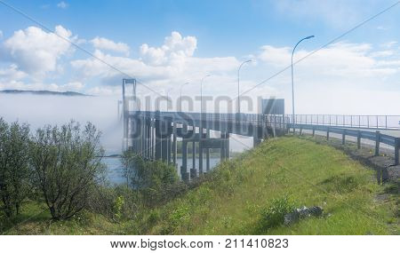 The Tjeldsund Bridge in the fog. The bridge connects the island Hinnoya with the mainland Norway