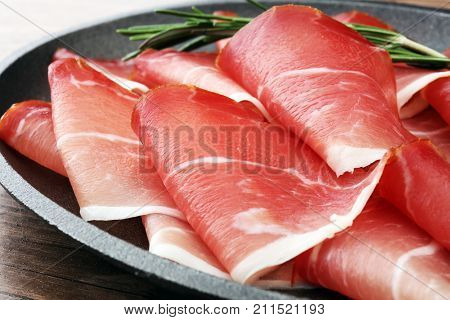 prosciutto with rosemary or ham of black forest or serrano.