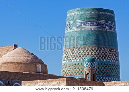 Unfinished turquoise-tiled Kalta Minor Minaret at Ichan Qala - Khiva, Uzbekistan
