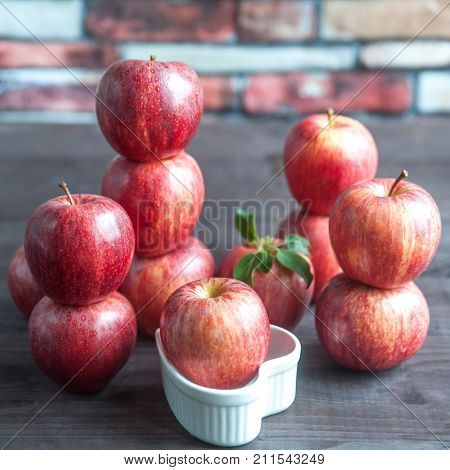 red juicy apples on the table background