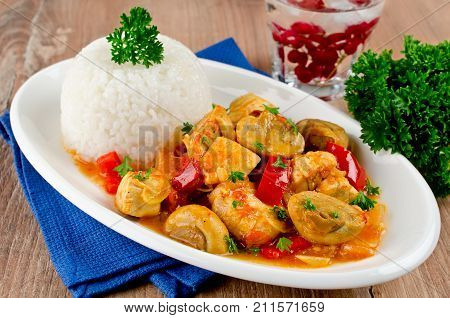 Chicken stew with mushrooms served with rice. Healthy and low calorie food
