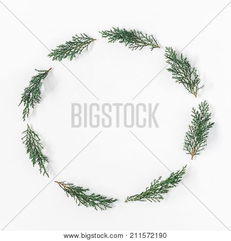 Christmas wreath made of pine branches on white background. Christmas winter new year concept. Flat lay top view copy space square