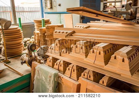 Stack of of lumber plank or boads in woodworking warehouse