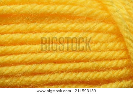Wool yarns for knitting. Close-up Yellow color