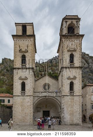 KOTOR MONTENEGRO - 27 SEPTEMBER 2017: Tourists gathered outside the Cathedral of St. Tryphon in Kotor Montenegro.