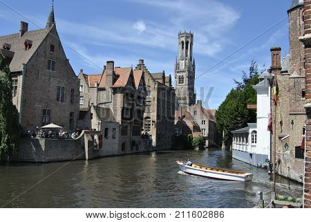 Postcard material site of Bruges from square and sight on canals