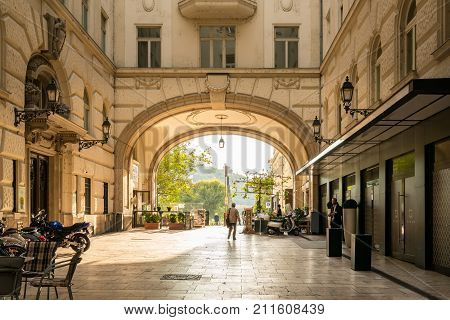 BUDAPEST HUNGARY - SEPTEMBER 26, 2017: City passage. 
People on a pedestrian passage from street Vaci utica through an arcuate building in Budapest Hungary on September 26, 2017.