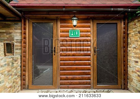 Public Toilet In Natural Wood Style. Male And Female