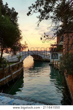 Couple standing on a bridge in Venice Italy