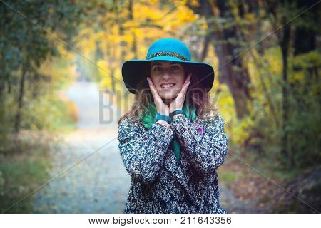 Pretty Romantic Girl In Autumn Clothes Walks In A Park. The Mood Of Autumn, Leaf Fall.