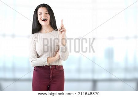Young Woman Happy Having An Ideia In A Blue Background