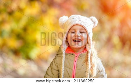 little girl in an autumn forest