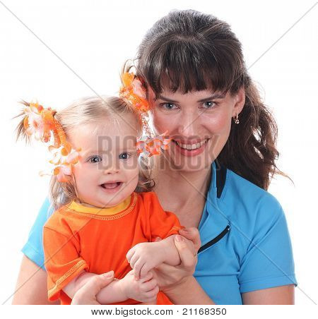 A happy mother holds a baby on hands.
