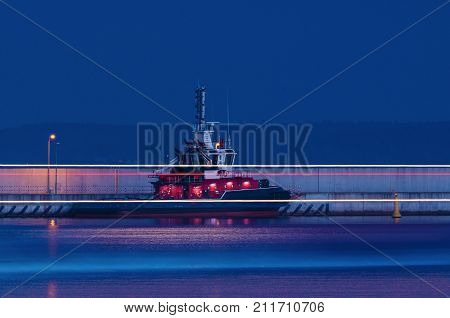 FIREBOAT - Night at the breakwater in the sea port