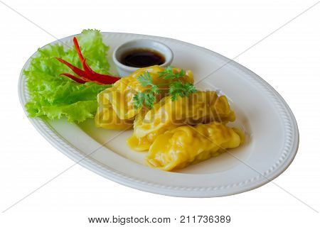 White isolated background with clipping paths homemade minced pork or shrimp dumpling dim sum on white plate served with dipping soy sauce so delicious for breakfast or lunch.Dim sum on white isolated background.