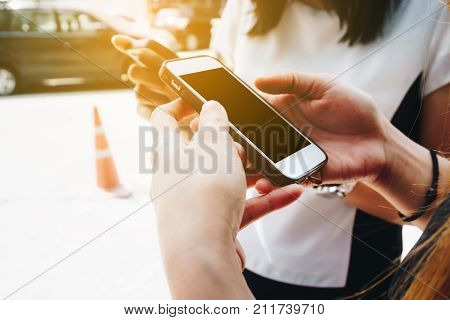 Group Of Women Use Cellphone Outdoor For Business Contact
