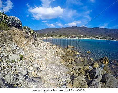 Rocks by the sea in La Speranza beach. Sardinia Italy