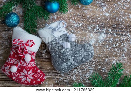 Christmas Stockings Pair On Snowbound Wooden Background, Blue Ball Ornaments